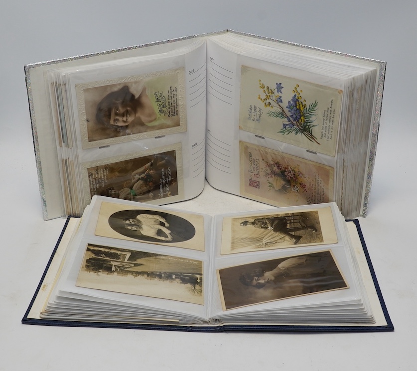 Two albums of Edwardian and later topographical and humorous postcards. Condition - good